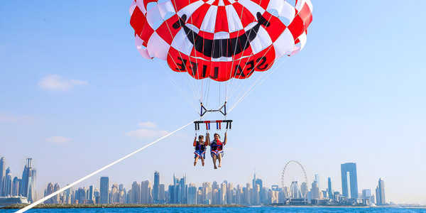     Parasailing over the Arabian Gulf with stunning aerial views of Dubai Marina
